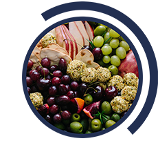 Theme: urban food systems. Fruits, olives, crackers, grapes and more in a bol.